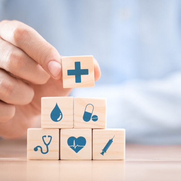 Health Insurance Concept Idea Presentation Using Blocks with Medicine Icons