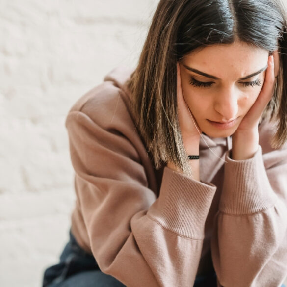 Sad woman sitting in doubt