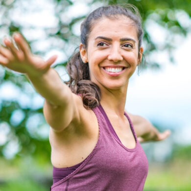 Teacher Leading Outdoor Yoga Retreat Practice