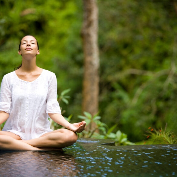 yoga teacher leading morning meditation in overseas retreat