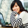 young woman in front of laptop