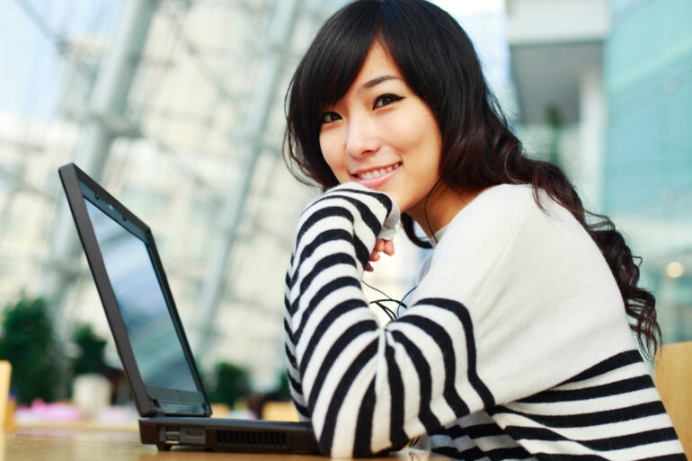 young woman in front of laptop