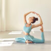 yoga teacher demonstrating a pose for students