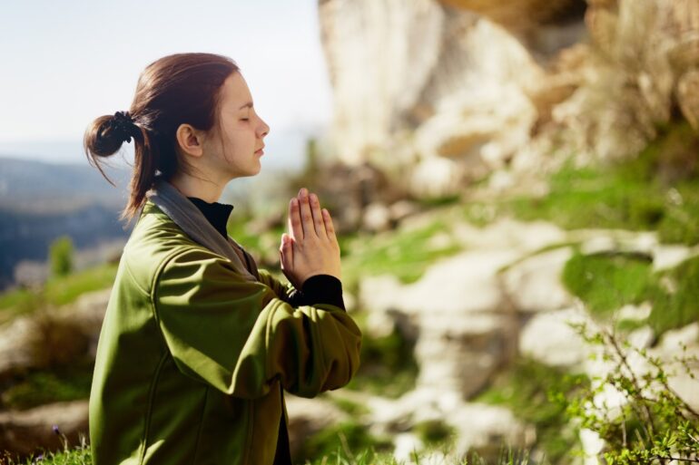 yoga teacher leading a class in spring time