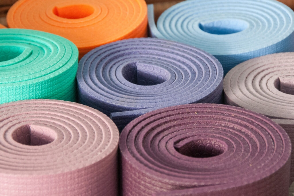 Woman Lying on Blue Yoga Mat